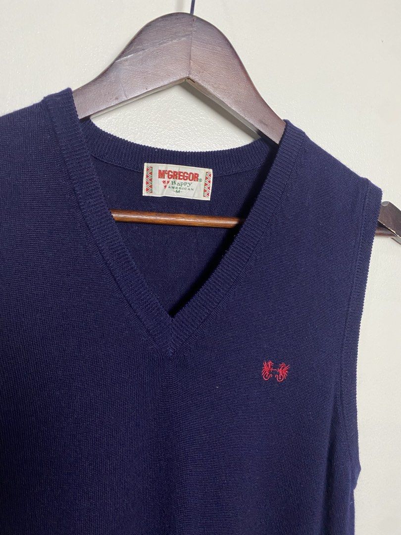 Mcgregor navy v-neck vest (Category: Others Tops) located in Makati City. Submitted by indaysukaycloset (Listing ID 1465869782, Image 2). Description: McGREGOR NAVY V-NECK VEST Brand: McGREGOR Happy American (Japan) Size: M on tag - Fits S-M Color: Navy Blue Details: - W-17 L-24 (laid flat, in inches) - V-neck sleeveless knit vest - Iconic small red embroidered logo (dual dragons) on left chest - Thick ribbed hem, soft fine knit - Material: NEW W