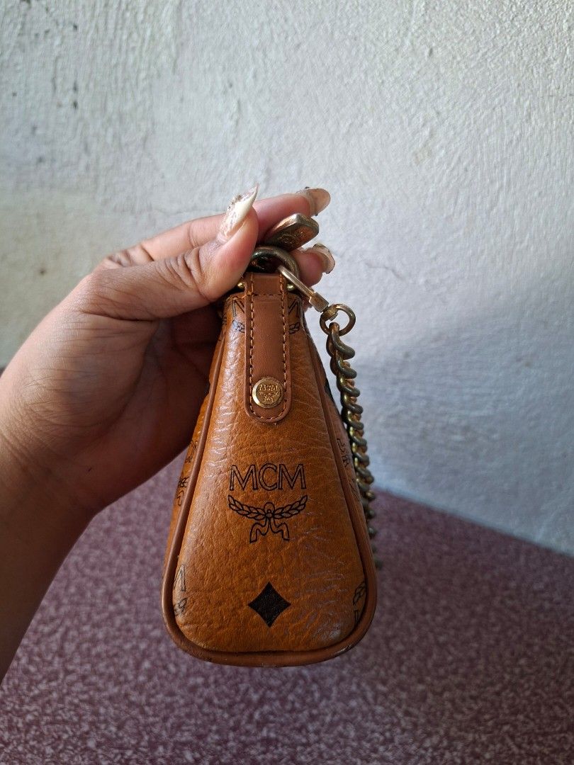 MCM Monogram Print Shoulder Bag with Pink Stripe (Category: Luxury Bags & Wallets) located in Guimba. Submitted by imerlouberlykym (Listing ID 1465766524, Image 3). Description: NGA ykk and turnable screw Sign of usagw sa corners and faded hardware .