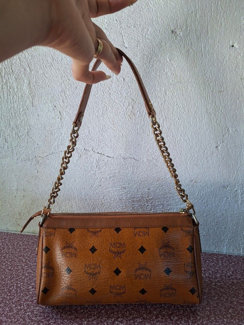 MCM Monogram Print Shoulder Bag with Pink Stripe (Category: Luxury Bags & Wallets) located in Guimba. Submitted by imerlouberlykym (Listing ID 1465766524, Image 2). Description: NGA ykk and turnable screw Sign of usagw sa corners and faded hardware .