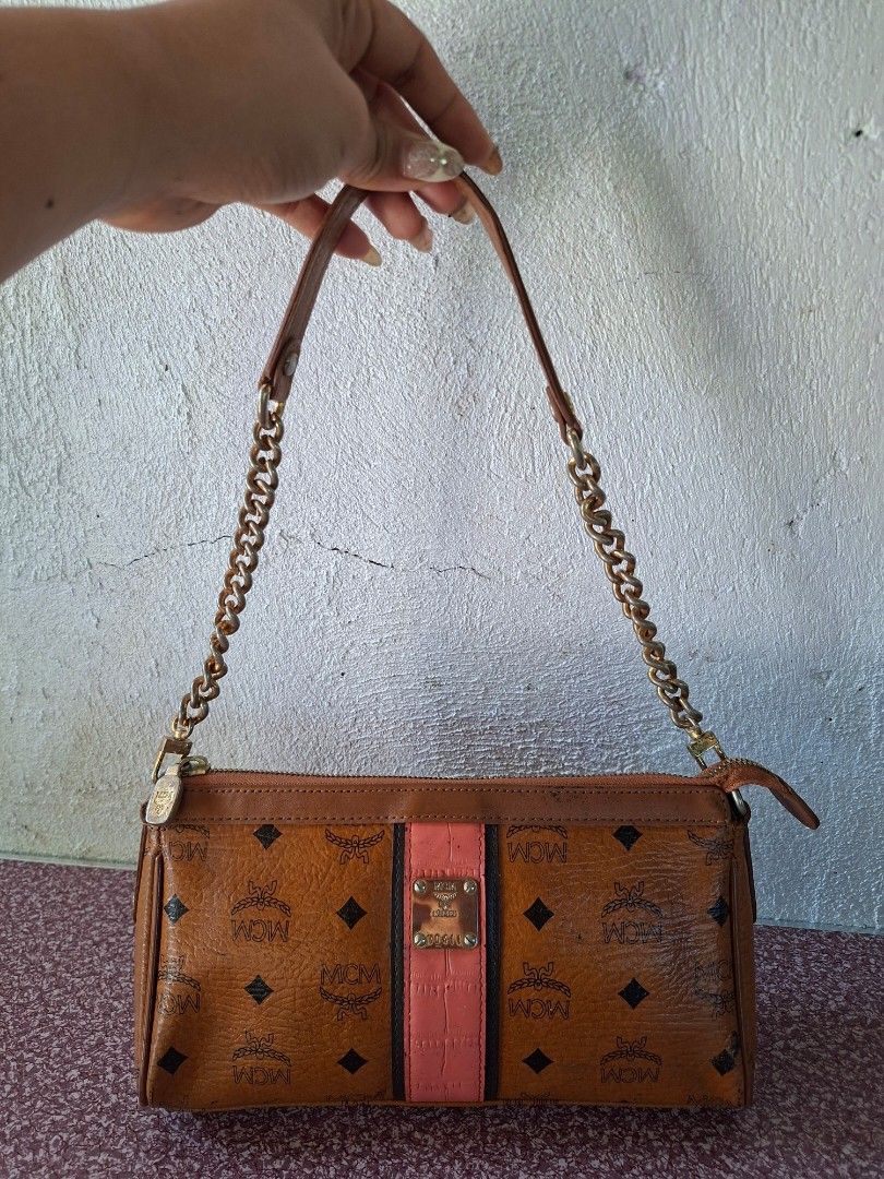 MCM Monogram Print Shoulder Bag with Pink Stripe (Category: Luxury Bags & Wallets) located in Guimba. Submitted by imerlouberlykym (Listing ID 1465766524, Image 1). Description: NGA ykk and turnable screw Sign of usagw sa corners and faded hardware .