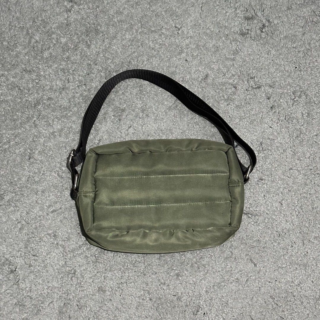 MEMO Olive Green Puffer Shoulder Bag (Category: Sling Bags) located in Lipa City. Submitted by jecoparra (Listing ID 1465835189, Image 1). Description: - Brand: MEMO - Color: Olive Green - Material: Quilted nylon exterior with soft padding and black fabric lining - Strap: Adjustable black strap with stylish silver hardware rings - Closure: Secure top zip - Pockets: Extra inner slip pockets for organization - Condition: Clean, well-maintained - Si