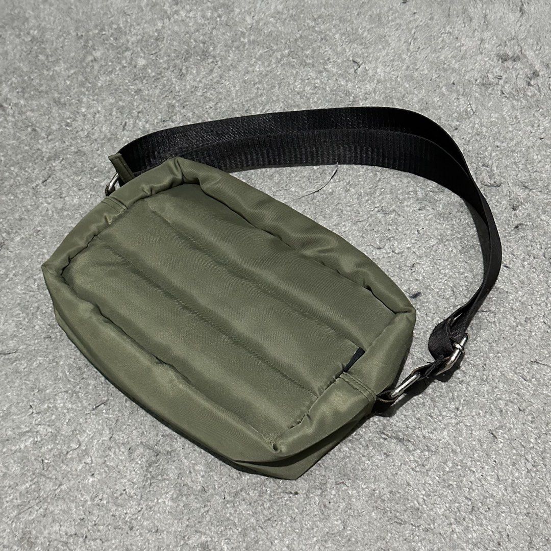 MEMO Olive Green Puffer Shoulder Bag (Category: Sling Bags) located in Lipa City. Submitted by jecoparra (Listing ID 1465835189, Image 3). Description: - Brand: MEMO - Color: Olive Green - Material: Quilted nylon exterior with soft padding and black fabric lining - Strap: Adjustable black strap with stylish silver hardware rings - Closure: Secure top zip - Pockets: Extra inner slip pockets for organization - Condition: Clean, well-maintained - Si