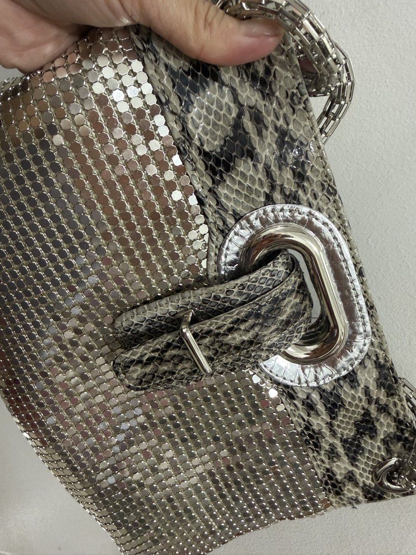 Metallic Snake Print Shoulder Bag With Chain Strap (Category: Shoulder Bags) located in Makati City. Submitted by petite_preloved2 (Listing ID 1465866497, Image 3). Description: Spacious enough to fit all your stuff for a night out Super pretty and lightweight party bag.
