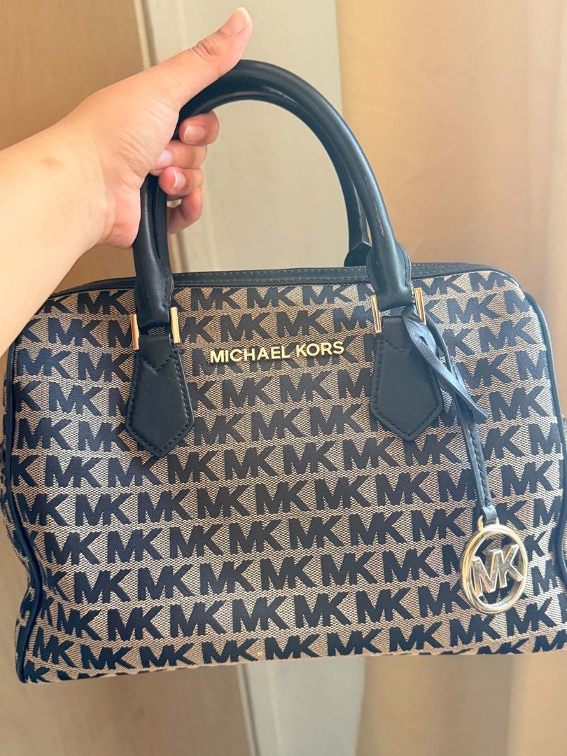 Michael Kors Bedford Medium (Category: Cross-body Bags) located in Pasay City. Submitted by matcastrou (Listing ID 1465846799, Image 1). Description: Dimensions: Approximately 11.25” W x 8.75” H x 6.25” D (approx. 28.5 cm x 22.2 cm x 15.8 cm) Hardware: Polished gold-tone metallic hardware, raised center logo lettering plaque, and a hanging circular MK medallion charm. Interior Lining: 100% polyester textile interior featuring one back zip pocket,