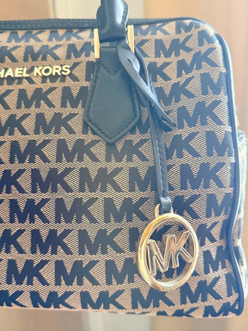 Michael Kors Bedford Medium (Category: Cross-body Bags) located in Pasay City. Submitted by matcastrou (Listing ID 1465846799, Image 2). Description: Dimensions: Approximately 11.25” W x 8.75” H x 6.25” D (approx. 28.5 cm x 22.2 cm x 15.8 cm) Hardware: Polished gold-tone metallic hardware, raised center logo lettering plaque, and a hanging circular MK medallion charm. Interior Lining: 100% polyester textile interior featuring one back zip pocket,