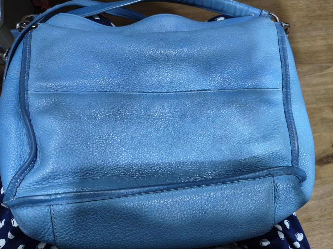 Michael Kors Blue Leather Crossbody Bag (Category: Cross-body Bags) located in Tarlac. Submitted by momma02 (Listing ID 1465783633, Image 3). Description: - Brand: Michael Kors - Color: Bright Blue - Material: Genuine pebbled leather - Hardware: Silver-tone with metal logo lettering - Closures: Secure zipper closures - Pockets: Convenient front pocket with pull tab detail - Strap: Includes adjustable and detachable long shoulder strap for versati