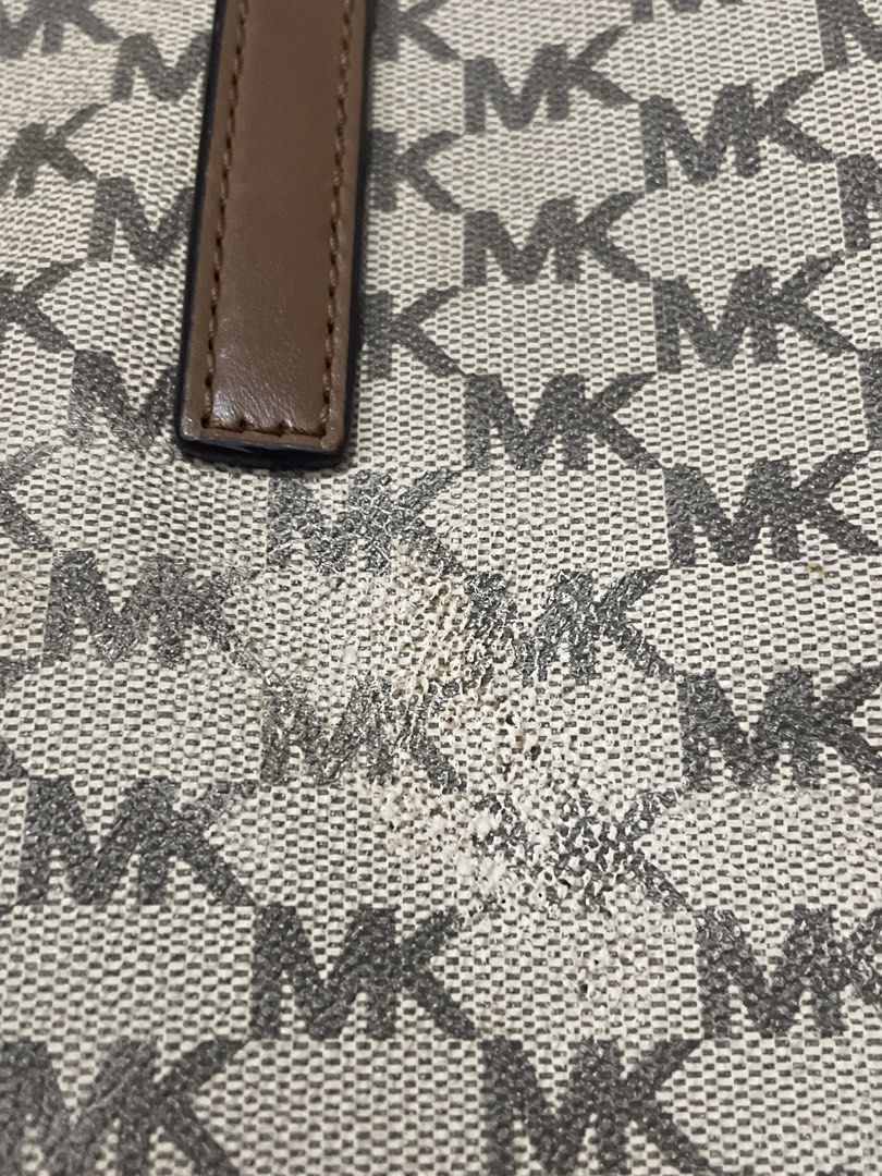 Michael Kors Brown MK Monogram Tote Bag (Category: Luxury Bags & Wallets) located in San Juan City. Submitted by redrosierose (Listing ID 1465950625, Image 3). Description: - Preloved Authentic Michael Kors tote bag in the iconic brown MK monogram pattern - Dual brown leather shoulder straps with clean stitching - Elegant gold-tone hardware and front logo lettering - Spacious interior, perfect for daily use and work essentials - Flaw: Noticeable 