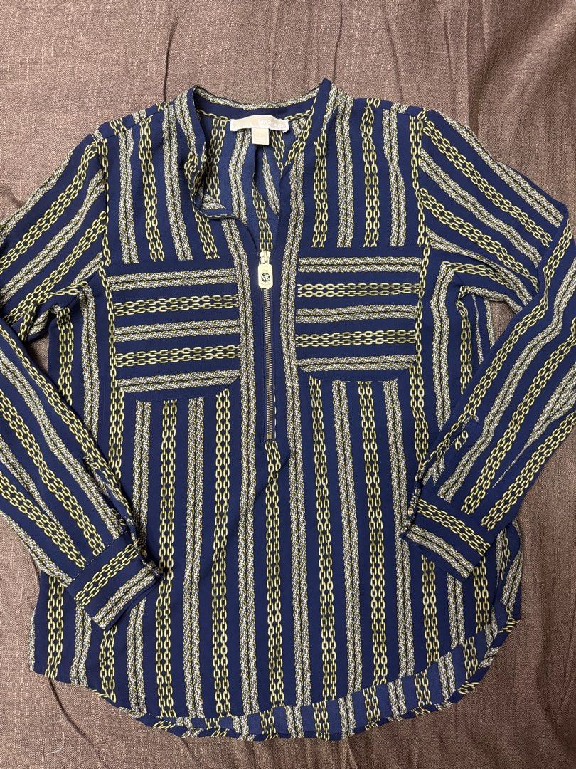 Michael Kors Chain Print Blue Blouse Size S (Category: Blouses) located in Quezon City. Submitted by mt031199 (Listing ID 1465947421, Image 1). Description: - Brand: Michael Kors - Size: Small - Color/Pattern: Deep blue with gold and white chain stripes - Features: Quarter-zip neckline with MK logo zipper pull, two front chest pockets - Fabric: Lightweight and comfortable - Condition: Brand new with tags - Ideal for: Workwear, smart-casual outing