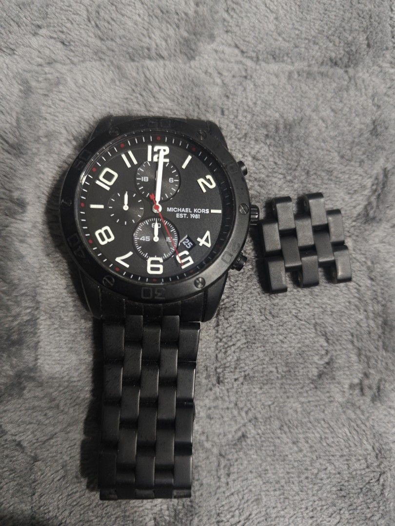 Michael Kors Chronograph Black Watch with Extra Links (Category: Luxury Watches) located in Manila. Submitted by hhebaccnt1 (Listing ID 1465843545, Image 1). Description: - Brand: Michael Kors Men's Watch - Color: Sleek all-black matte finish (case, bezel, and bracelet) - Dial: Dark dial with white numeric markers, 3 sub-dials, and date window - Closure: Secure deployment clasp - Extras: Includes 4 removable links for easy wrist sizing - Mode of 