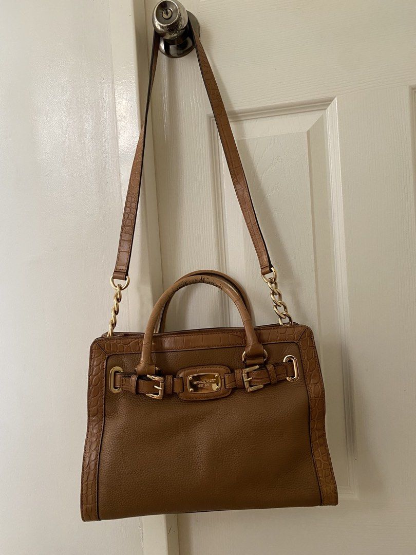 Michael Kors Hamilton Satchel (Category: Shoulder Bags) located in Las Pinas. Submitted by sherylandmargaux (Listing ID 1465846731, Image 1). Description: • Brand: MICHAEL Michael Kors • Model: Hamilton (East-West Satchel/Tote style) • Material: Brown pebbled leather body with croc-embossed trim and dual top handles • Hardware: Gold-tone accents, logo-engraved buckle/belt detail, and chain-link shoulder strap.