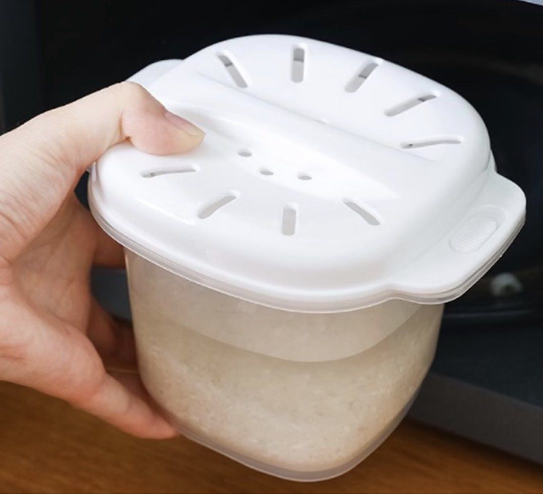 Microwave Rice Cooker Cookware Steamer Rice Container (Category: Cookware & Accessories) located in Manila. Submitted by jhie24 (Listing ID 1465800859, Image 1). Description: - Microwave-safe rice cooker container for quick and easy meals - Includes main pot, inner strainer basket, and vented lid with side handles - Versatile: great for cooking, reheating, and storing leftovers in the fridge - Clear plastic body allows you to easily check water l
