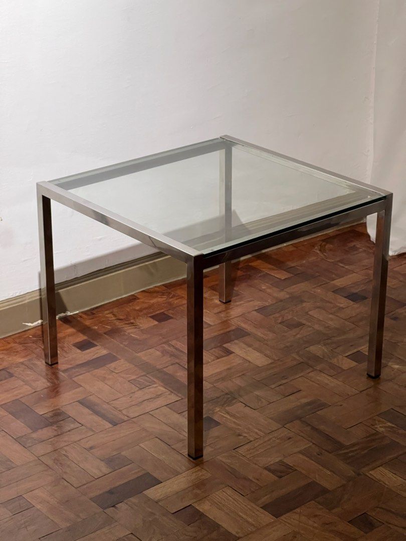 Midcentury Chrome and Glass Coffee Table (Category: Tables & Sets) located in Quezon City. Submitted by raccoonfur (Listing ID 1465873089, Image 1). Description: Minimalist side table made of chrome and glass. Has that silent/seamless air to it. Like a Philip Johnson piece from the 60’s. Tempered glass. 60x60x49cm Pick up at Legazpi vill, Makati. .
