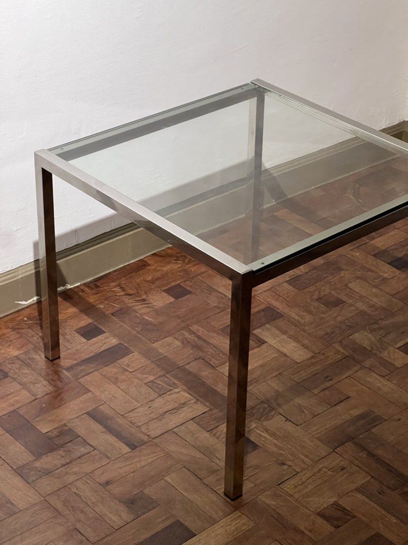 Midcentury Chrome and Glass Coffee Table (Category: Tables & Sets) located in Quezon City. Submitted by raccoonfur (Listing ID 1465873089, Image 2). Description: Minimalist side table made of chrome and glass. Has that silent/seamless air to it. Like a Philip Johnson piece from the 60’s. Tempered glass. 60x60x49cm Pick up at Legazpi vill, Makati. .
