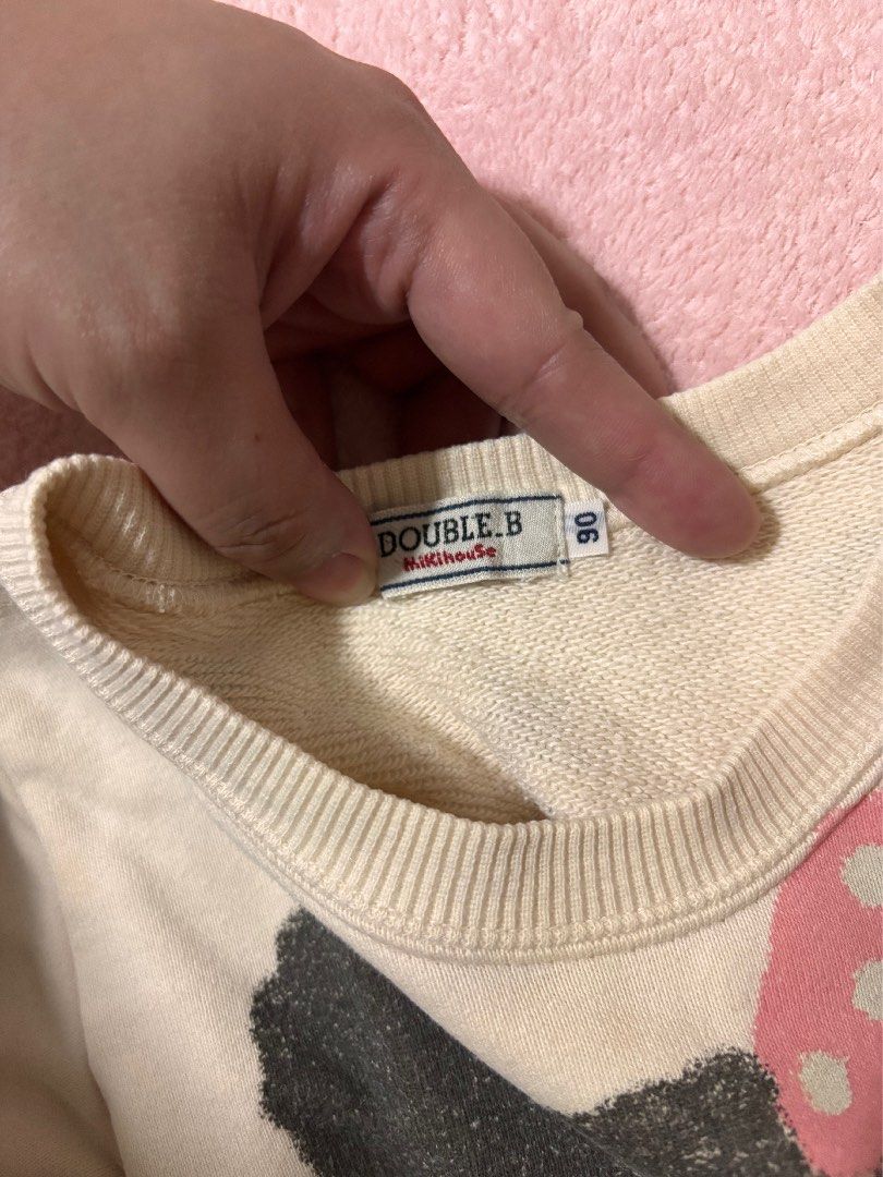 Miki House Double.B sweatshirt (Category: Babies & Kids Fashion) located in Quezon City. Submitted by closettreasure123 (Listing ID 1465846951, Image 2). Description: 1-3yrs old No issue It features a large, textured graphic of B-ko Chan (the signature female black bear character from the Double.B line) wearing a pink polka-dot bow and a matching polka-dot shirt. The background is accented with small blue stars and yellow block text reading “DOUB