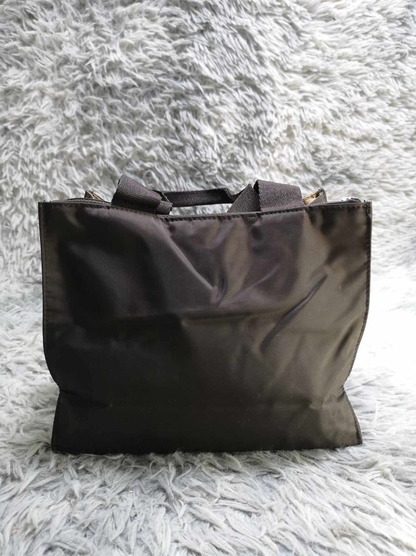 Minimalist Black Tote Bag (Category: Tote Bags) located in Santa Cruz. Submitted by jmy_surplus.2 (Listing ID 1465886053, Image 1). Description: Size ; L - 7.4 W - 9 Color ; Black Type ; Tote Bag Brand ; No brand Material ; Nylon Style ; Black Square Mini Tote Bag LR 129 JMY 5 Batch #224.