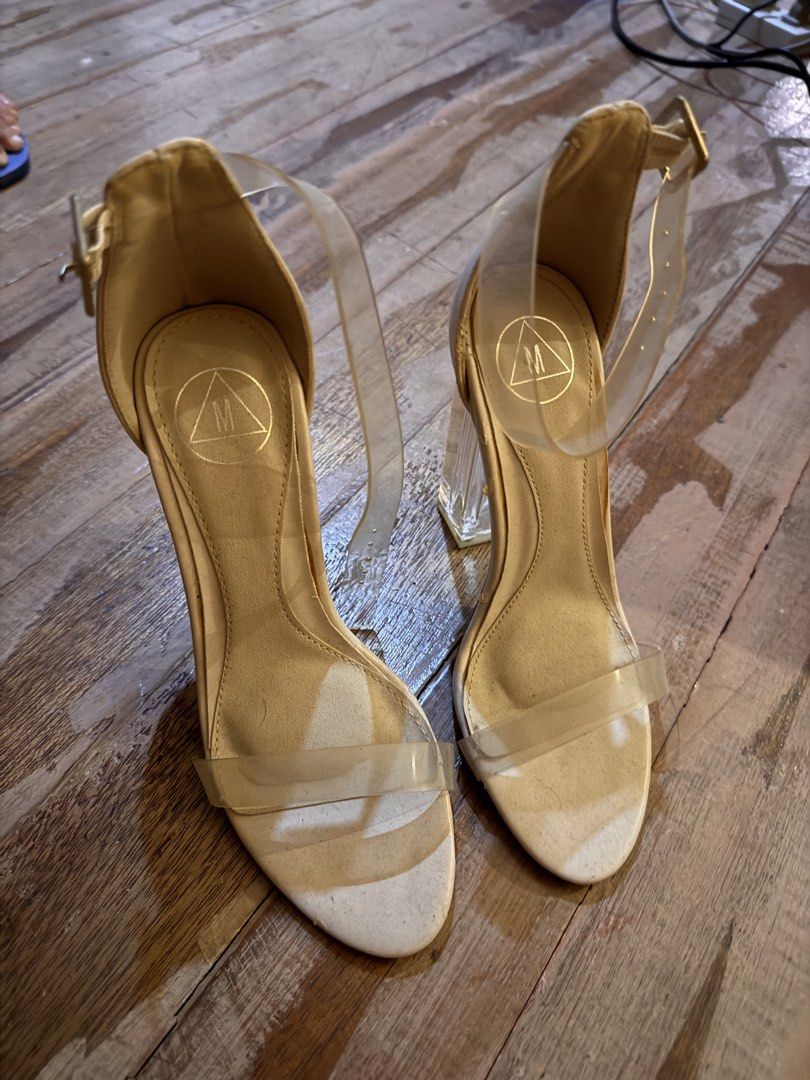 Missguided Clear Block Heel Sandals (Category: Heels) located in Pasig City. Submitted by klaaaaa (Listing ID 1465878483, Image 1). Description: - Brand: Missguided - Type: Nude heels with clear block heels and transparent ankle strap - Size: UK 3 / EU 36 - Design: Open toe with adjustable ankle buckle fastening - Condition: Soles show minor wear from previous outings, still plenty of life left.
