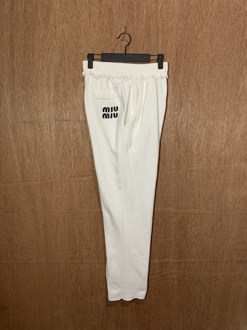 Miu Miu White Sweatpants Joggers (Category: Other Bottoms) located in Tacurong. Submitted by ljsthrift (Listing ID 1465764270, Image 2). Description: - Brand: Miu Miu - Color: Clean White - Fit: Relaxed fit with soft cotton terry interior for ultimate comfort - Details: Elastic waistband with ruffled trim, single back pocket with black printed logo - Origin: Made in Italy - Condition: Gently worn.