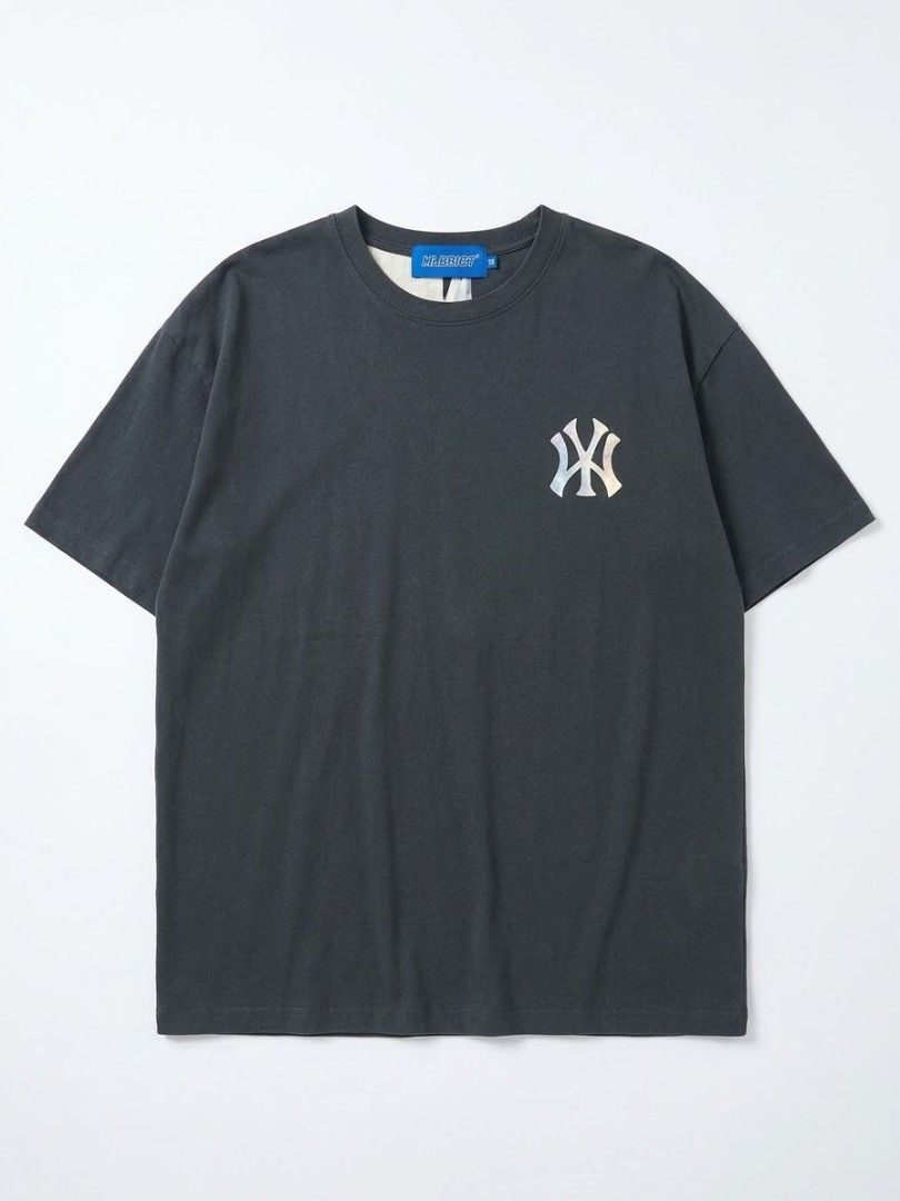 MLB Dark Grey Graphic Print T-Shirt (Category: Tshirts & Polo Shirts ) located in Manila. Submitted by sheilam.autumnstreet (Listing ID 1465904394, Image 1). Description: - Brand: MLB - Color: Dark grey - Size: Small - Fit: Relaxed fit, short sleeves - Design: Small interlocking NY logo on left chest; large, colorful abstract graphic print with portrait detail on the back - Style: Casual streetwear - Condition: Clean, graphics fully intact with n