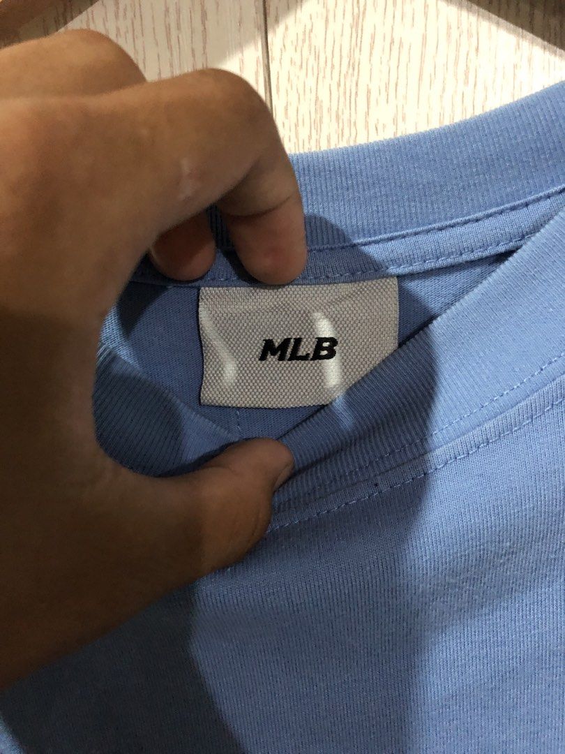 MLB LA Dodgers Light Blue T-Shirt (Category: Tshirts & Polo Shirts ) located in Magsaysay. Submitted by ryns_thrifting (Listing ID 1465896141, Image 2). Description: - Brand: MLB (Genuine merchandise tag attached) - Team: LA Dodgers - Color: Light Blue - Size: S - Material: Clean, comfortable cotton - Design: Embroidered Dodgers logo on front chest, large graphic print with small logos on the back - Fit: Short sleeves with classic crew neckline.