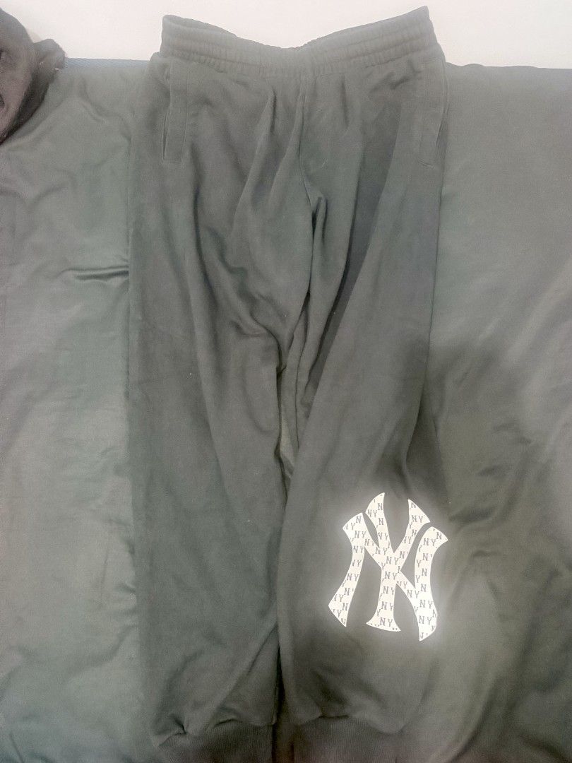 MLB New York Yankees Black Sweatpants (Category: Joggers) located in Caloocan City. Submitted by iandoom09 (Listing ID 1465845906, Image 1). Description: - Authentic MLB New York Yankees merchandise - Color: Classic black - Design: Large NY team logo near the bottom cuff with miniature logo graphics inside - Fit: Comfortable elastic waistband and matching ankle cuffs - Condition: Brand new with official MLB tags attached showing size and material