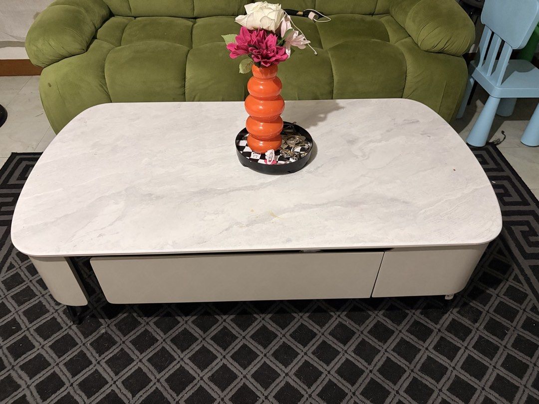 Modern White Marble Top Coffee Table with Storage Drawer (Category: Tables & Sets) located in Mandaluyong City. Submitted by nellyme. (Listing ID 1465787609, Image 1). Description: - Modern white marble-pattern top with safe, rounded edges - Convenient long storage drawer underneath to keep your living room clutter-free - Sturdy metal legs for reliable stability - Contemporary design that easily blends with any home decor - Low maintenance: easy 