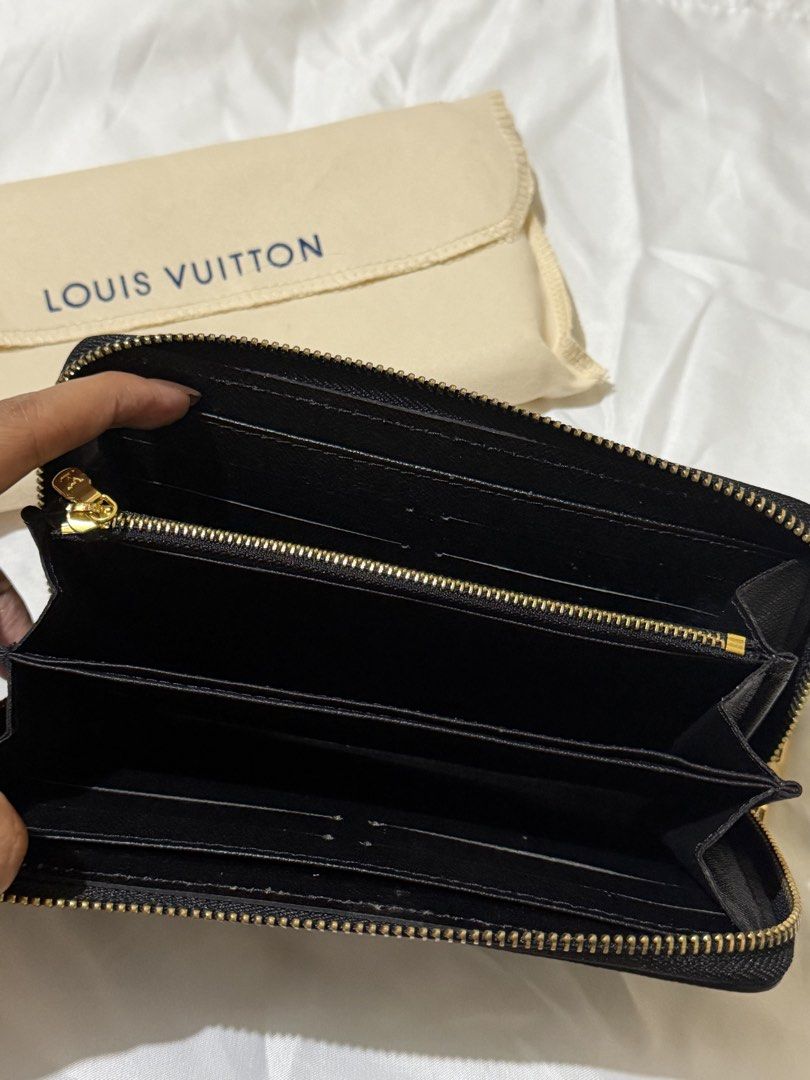 Monogram Empreinte Zippy Wallet Black Beige (Category: Luxury Bags & Wallets) located in Caloocan City. Submitted by amberbear12 (Listing ID 1465815979, Image 2). Description: - Black Empreinte leather with chic beige Monogram pattern - Secure all-around gold-tone zipper hardware - Interior includes multiple card slots, slip pockets, and a zippered coin compartment - Clean exterior and interior condition - Includes dust bag - Guaranteed authentic