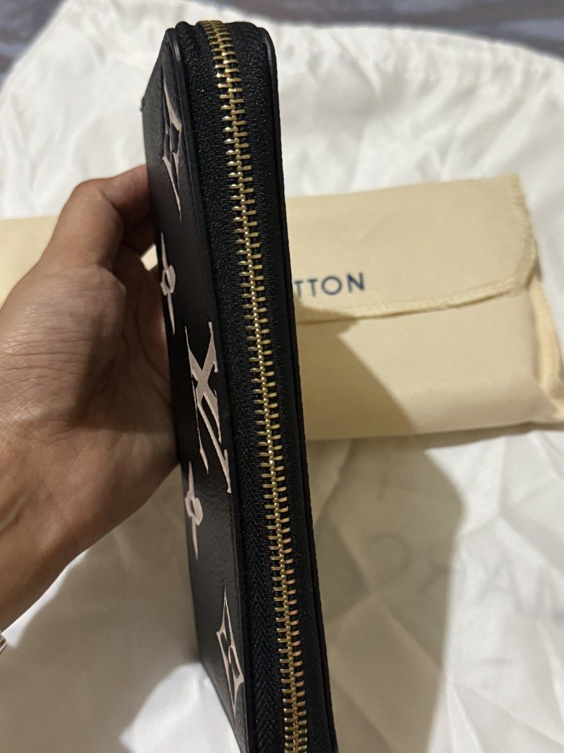 Monogram Empreinte Zippy Wallet Black Beige (Category: Luxury Bags & Wallets) located in Caloocan City. Submitted by amberbear12 (Listing ID 1465815979, Image 1). Description: - Black Empreinte leather with chic beige Monogram pattern - Secure all-around gold-tone zipper hardware - Interior includes multiple card slots, slip pockets, and a zippered coin compartment - Clean exterior and interior condition - Includes dust bag - Guaranteed authentic