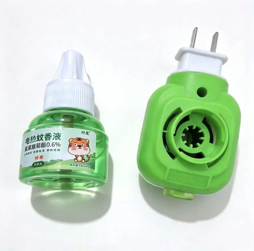 Mosquito Repellent Liquid and Refill Set (Category: Sanitizers & Disinfectants) located in Quezon City. Submitted by ana-chan (Listing ID 1465773035, Image 2). Description: - Complete electric mosquito repellent set including plug-in heater and green liquid refill - Contains 0.6% metofluthrin for effective bug protection - Features an adorable tiger cartoon design on the bottle - Standard two-prong plug fits easily into any wall outlet - Brand ne