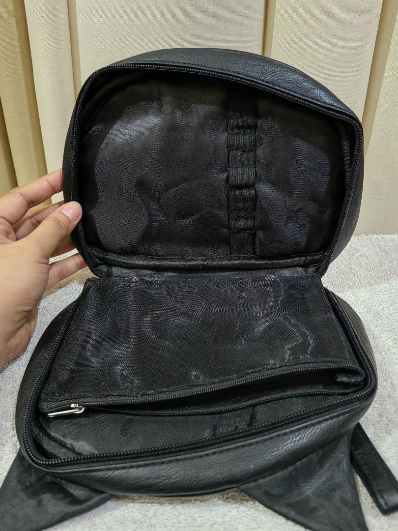 MSQ Black Cat Ear Pouch organizer (Category: Accessory Holder, Box & Organizers) located in Makati City. Submitted by prelovedtreatedwithlove (Listing ID 1465783384, Image 2). Description: - Adorable cat-shaped design in black faux leather with cute ears - MSQ brand - Includes a convenient matching wrist strap on the side - Interior is fully lined with black fabric - Equipped with mesh zipper pockets and elastic loops to securely hold brushes or 