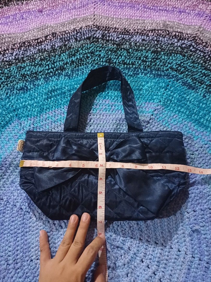 NaRaYa Blue Quilted Handbag with Bow (Category: Shoulder Bags) located in San Pedro. Submitted by purpledream0316 (Listing ID 1465894914, Image 2). Description: - Brand: NaRaYa - Material: Soft blue satin with diamond quilting - Design: Elegant large bow on the front panel - Handles: Secure dual carry handles - Size: Approx. 9 x 8 inches (compact for daily essentials or evening outs) - Condition: Excellent.