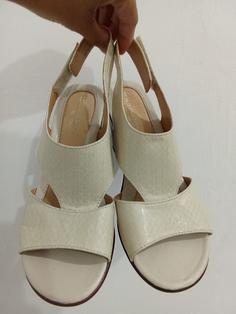 Naturalizer Wedge Sandals Off-White (Category: Flats & Sandals) located in Quezon City. Submitted by jane019 (Listing ID 1465902749, Image 1). Description: - Brand: Naturalizer - Style: Slingback wedges with open toe and wide cutout straps - Color: Off-white textured upper with brown stacked heels - Closure: Adjustable hook and loop back strap for a secure fit - Comfort: Cushioned insoles for all-day wear - Sole: Rubber grip soles with gently wor