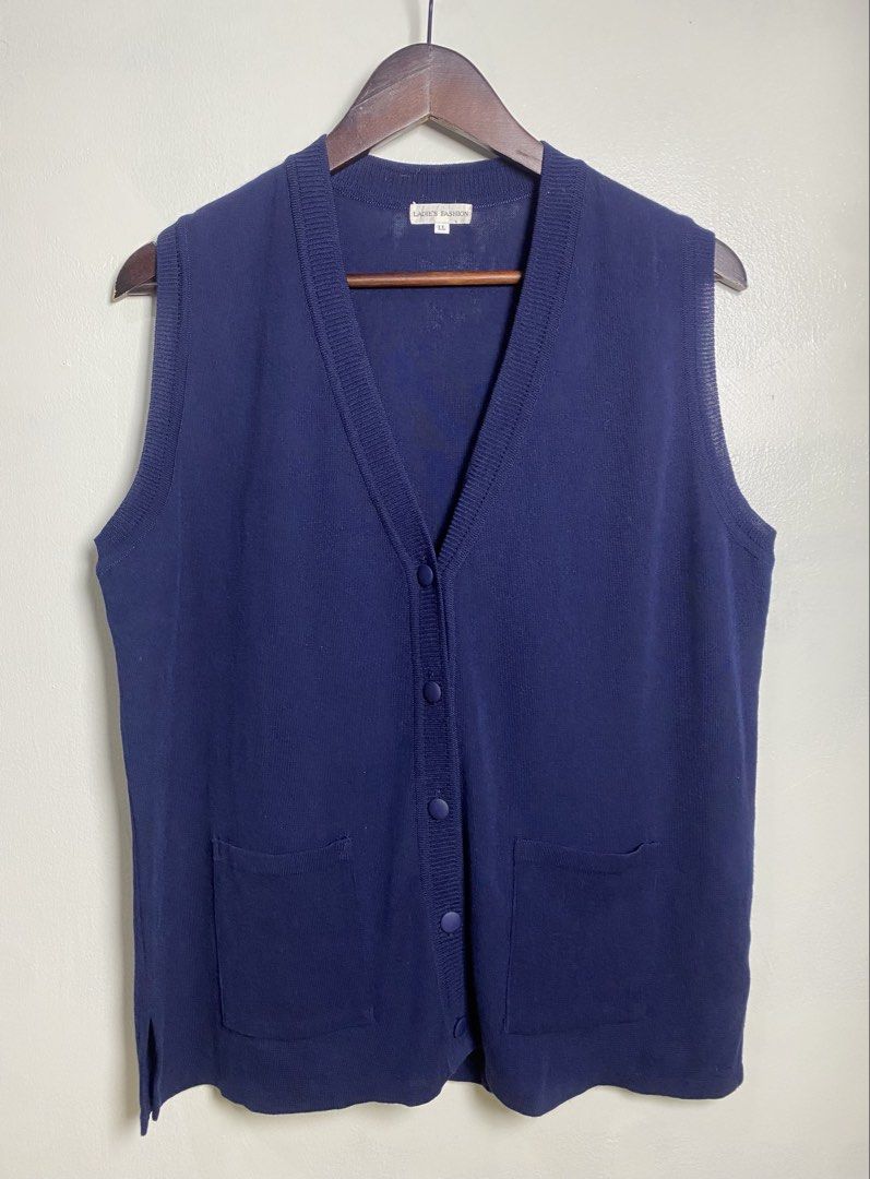 Navy blue button vest (Category: Others Tops) located in Makati City. Submitted by indaysukaycloset (Listing ID 1465842786, Image 1). Description: NAVY BLUE BUTTON VEST Brand: LADIE'S FASHION (Japan Brand) Size: LL on tag - Fits L-XL Color: Navy Blue Details: - W-20.5 L-24 (laid flat, in inches) - V-neck sleeveless button-down vest - Front 5-button closure (fabric-covered buttons) - 2 front patch pockets - Side slits on hem - Fine knit, soft and 