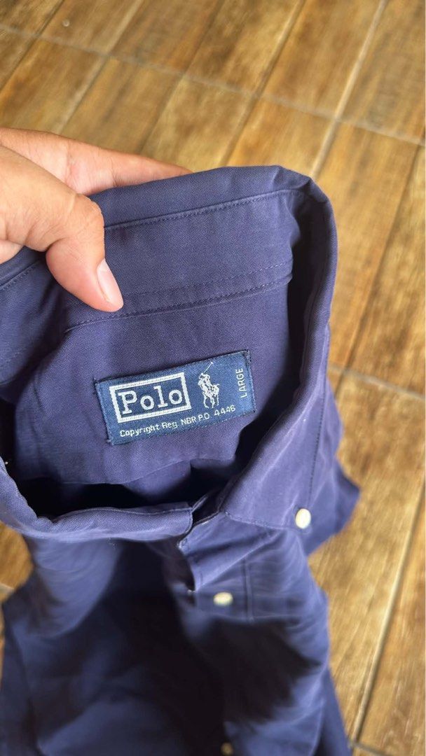 NAVY BLUE RALPH LAUREN BUTTON DOWN (Category: Tshirts & Polo Shirts ) located in Manila. Submitted by urban.vintage (Listing ID 1465792147, Image 2). Description: ISSUE: NONE (NEED WASH) MOP :GCASH (NO COD) SHIP VIA: LALAMOVE & J&T LOCATION: PASIG CITY LENGTH: 29 WIDTH :23 .