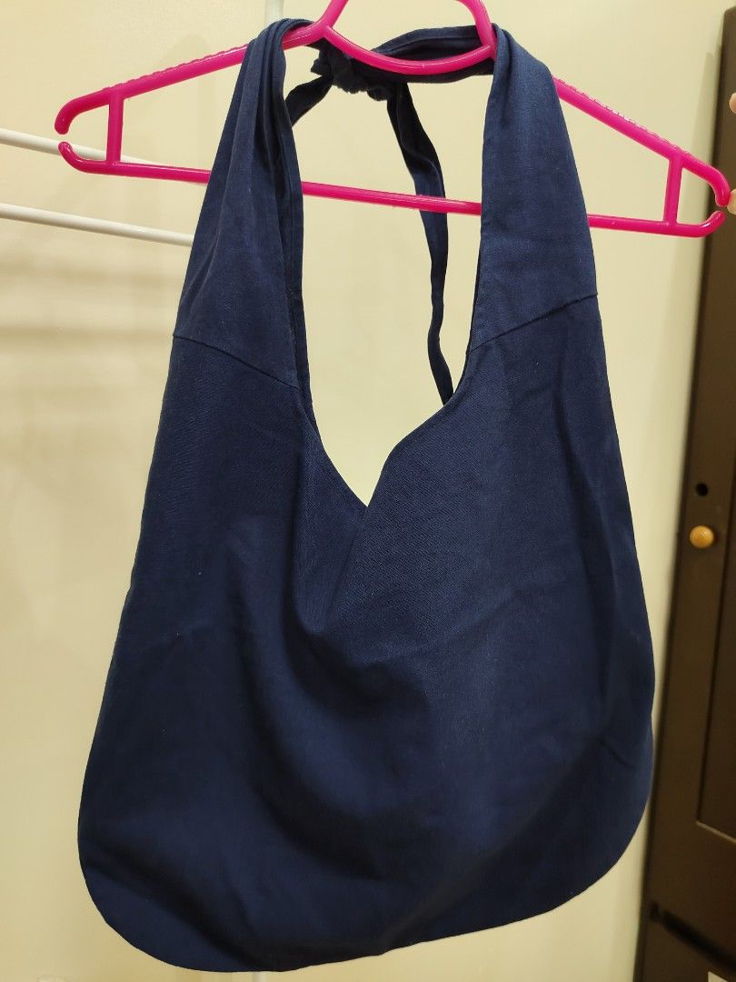 Navy Blue Slouchy Tote Bag with Front Pocket (Category: Tote Bags) located in Manila. Submitted by clairevald34303 (Listing ID 1465909945, Image 2). Description: - Color: Classic Navy Blue - Material: Durable cotton canvas - Design: Slouchy, casual everyday shoulder bag - Storage: Deep main compartment for daily essentials + convenient front pocket for keys or cards - Straps: Tied top straps with adjustable drop length.