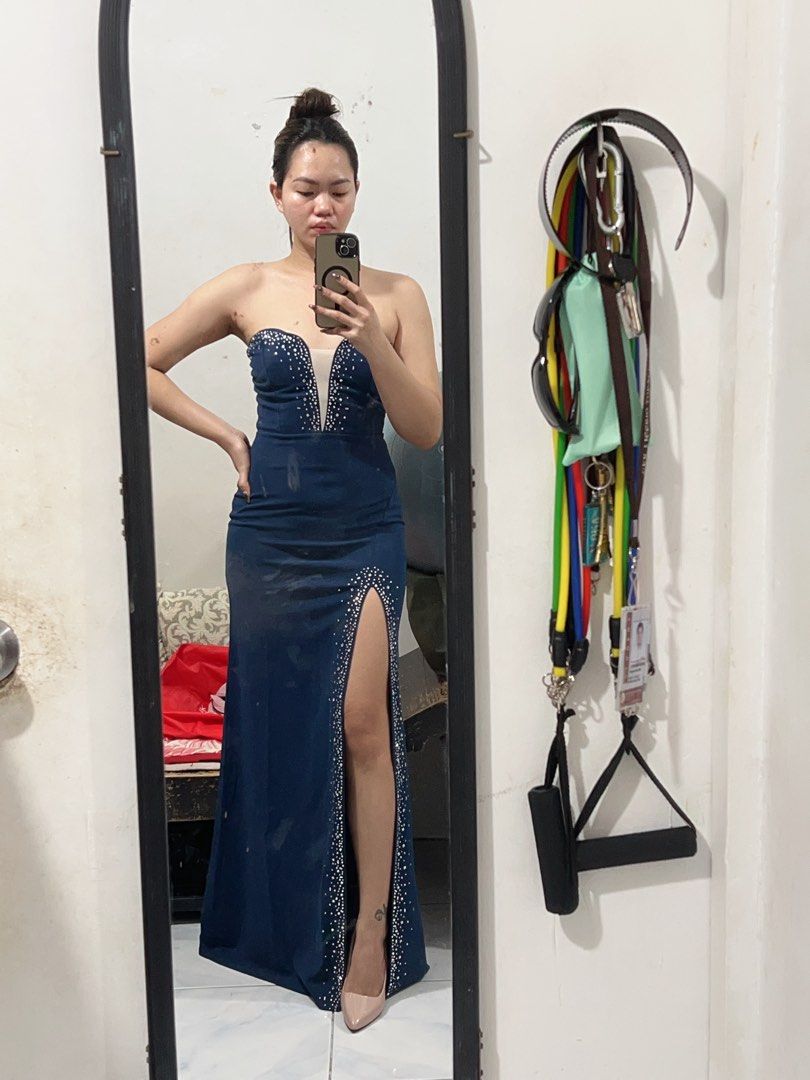 Navy Blue Strapless Rhinestone Split Maxi Dress Size S (Category: Evening dresses & gowns) located in Imus. Submitted by anggeshop (Listing ID 1465887394, Image 2). Description: - Color: Navy Blue - Size: Small (S) - Neckline: Strapless sweetheart with sheer mesh insert - Details: Sparkly rhinestone embellishments along the bust, sheer panel, and high leg slit - Fit: Smooth, body-hugging silhouette - Bought 1,500.