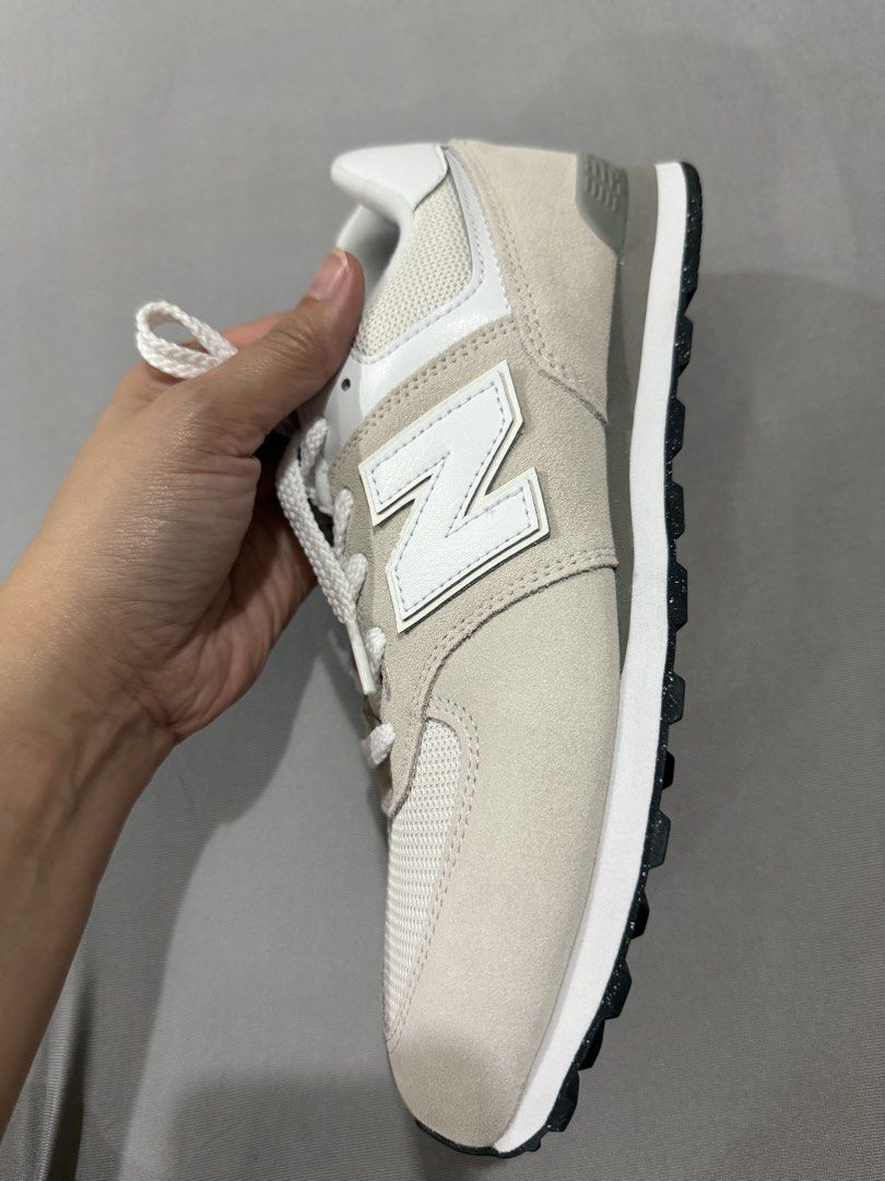 Authentic New Balance 574 Off-White Grey Size US 7 (Category: Sneakers) located in Quezon City. Submitted by rc1415 (Listing ID 1465763568, Image 3). Description: - Brand: New Balance 574 no box - Colorway: Off-White and Grey - Size: US 7 / UK 6.5 / EU 40 / CM 25 - Material: Classic suede and mesh upper with rubber outsole - Condition: Crisp uppers and clean soles with great traction - Inclusions: Comes with original white laces.