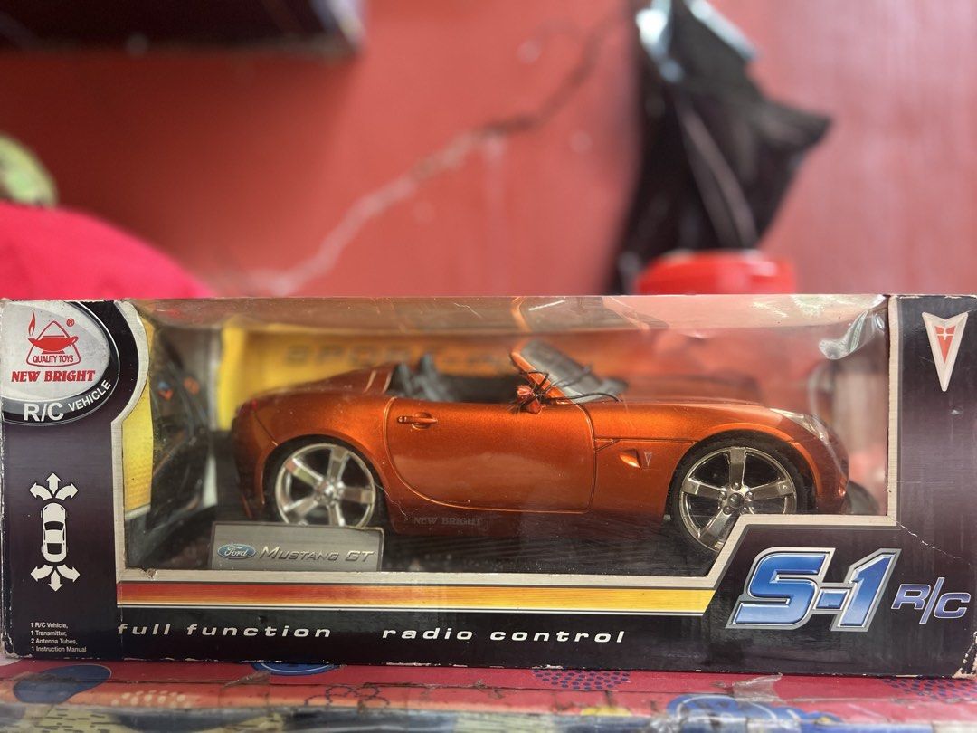 New Bright Ford Mustang GT Remote Control Car (Category: Remote Control Toys) located in Quezon City. Submitted by howl_02 (Listing ID 1465834128, Image 1). Description: - Brand: New Bright - Item: Radio-controlled convertible car - Color: Vibrant orange with detailed black interior - Condition: Brand new old stock - Frequency: 27 MHz - Includes: Original box and black remote control - Condition: Clean battery compartment, uses standard batteries