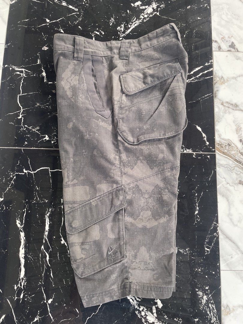 Nike ACG Cargo Shorts Camo Grey (Category: Shorts) located in Catigbian. Submitted by ekong_yeager (Listing ID 1464666172, Image 1). Description: - Grey Nike ACG cargo shorts - Subtle camouflage pattern - Multiple storage pockets - Button and zip fly closure - Ideal for outdoor activities and casual wear - Comfortable fit Vintage Nike ACG Cargo Short Price: 850+shipping fee Excellent condition Color rate 9/10 No issue Fresh from bale Washed and r