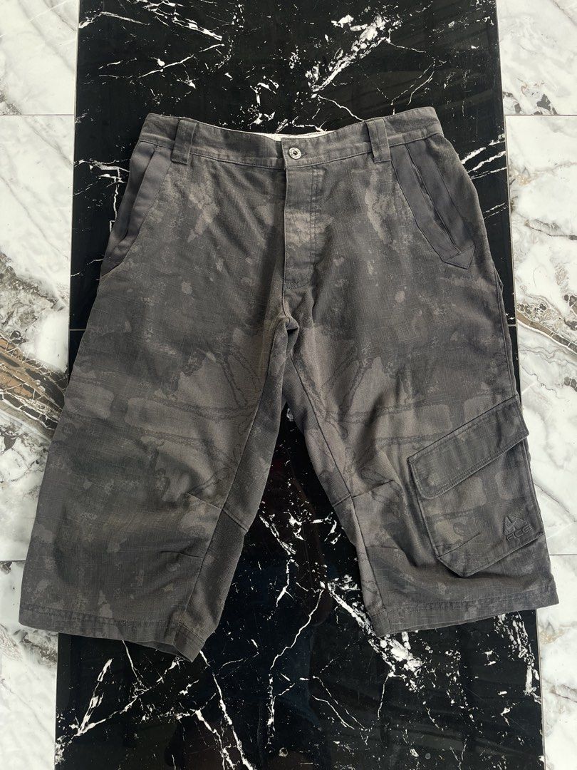 Nike ACG Cargo Shorts Camo Grey (Category: Shorts) located in Catigbian. Submitted by ekong_yeager (Listing ID 1464666172, Image 3). Description: - Grey Nike ACG cargo shorts - Subtle camouflage pattern - Multiple storage pockets - Button and zip fly closure - Ideal for outdoor activities and casual wear - Comfortable fit Vintage Nike ACG Cargo Short Price: 850+shipping fee Excellent condition Color rate 9/10 No issue Fresh from bale Washed and r