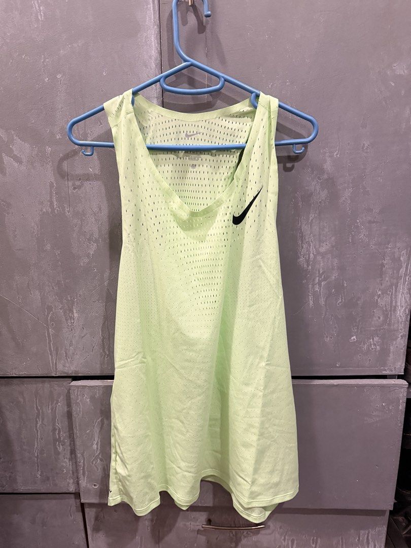 Nike aeroswift singlet (Category: Activewear) located in Manila. Submitted by pacb1212 (Listing ID 1465820754, Image 1). Description: - Brand: Nike - Item: Athletic Tank Top - Color: Bright lime green with black Nike swoosh logo - Size: 2XL - Material/Tech: Dri-FIT ADV technology with all-over perforated mesh for maximum breathability - Design: Racerback - Origin: Made in Cambodia - Condition: Great for workouts and active wear Sinukat lang, pero