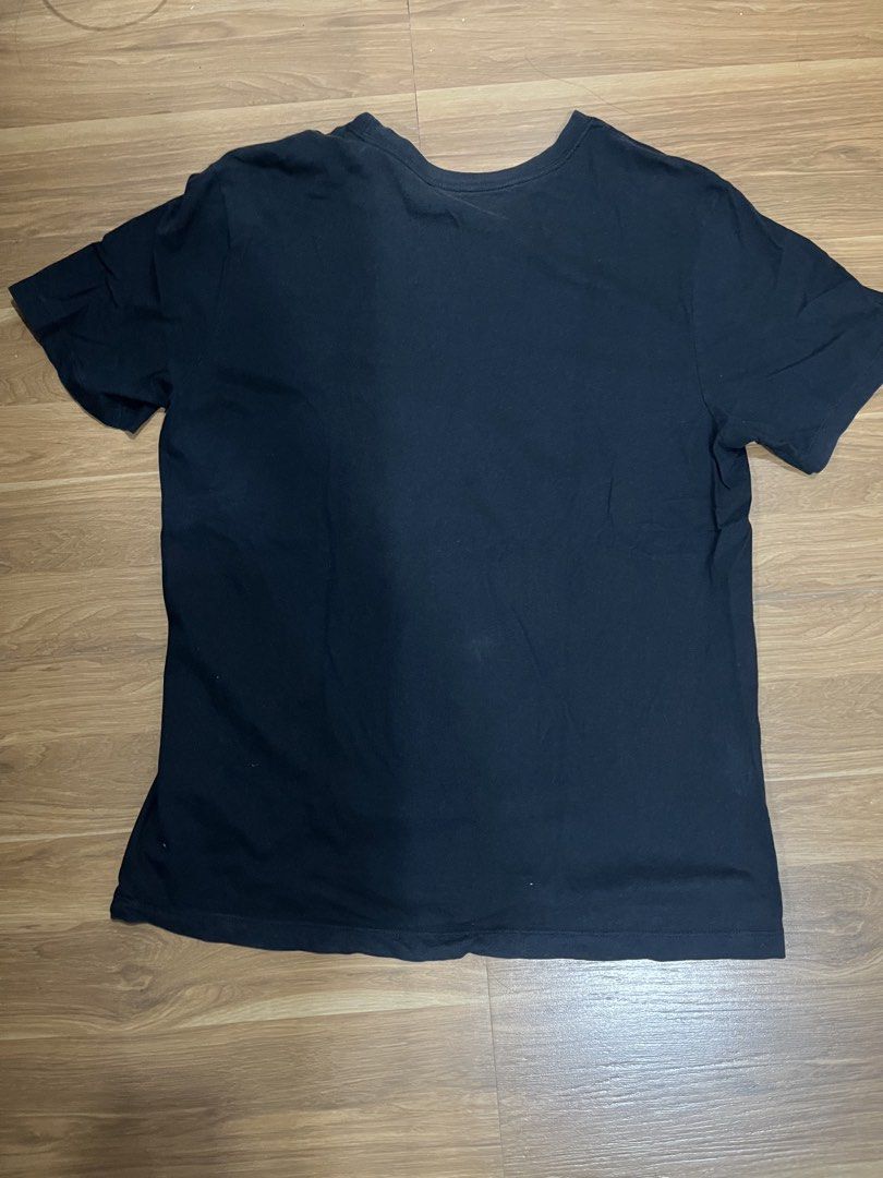 Nike Air Black T-Shirt (Category: Tshirts & Polo Shirts ) located in San Fernando. Submitted by nathan_pasahol (Listing ID 1465912863, Image 2). Description: - Brand: Nike Air - Color: Black with classic swoosh logo on chest - Fit: Standard fit, crew neckline, short sleeves - Condition: Excellent, clean fabric with no stains or holes - Style: Great for everyday casual wear DIMENSIONS: LENGTH: 28.5 Inches WIDTH: 21 Inches.