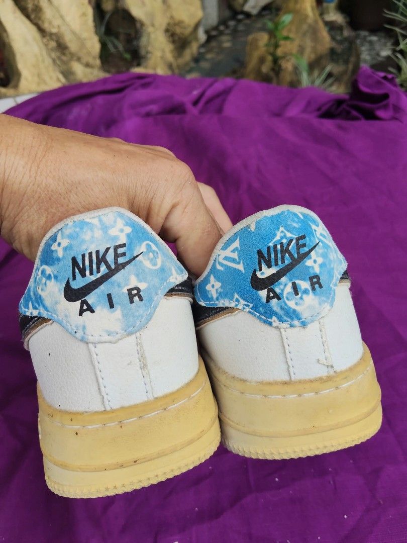 Nike Air Force 1 Custom Blue LV Monogram Size 7.5 (Category: Sneakers) located in Caloocan City. Submitted by kaymatias (Listing ID 1465909884, Image 2). Description: - Model: Custom Nike Air Force 1 - Size: US 7.5 / EUR 41 / JAP 25.5 - Details: White leather upper, blue Louis Vuitton monogram accents on side panels and heel tab, classic black swoosh overlays - Condition: Soles show visible yellowing from age and wear, underside treads have dirt 