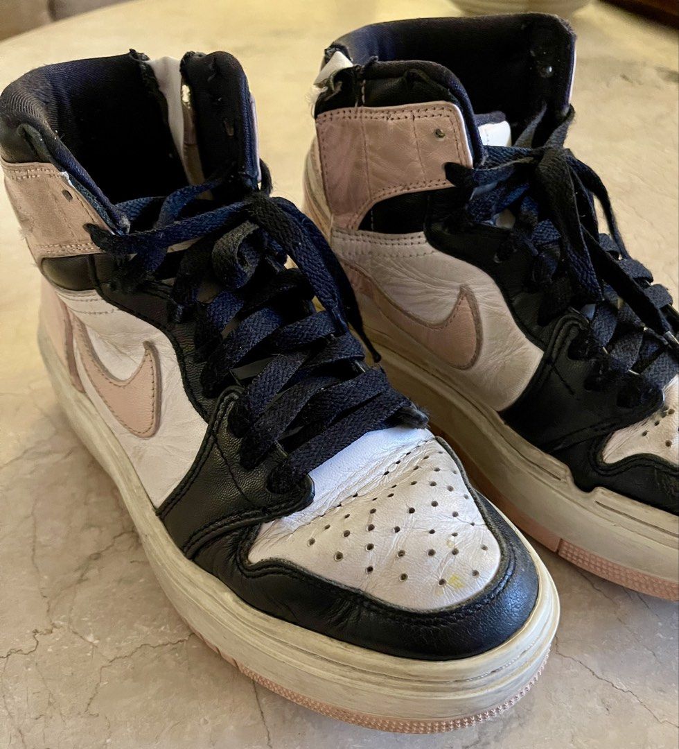 Nike Air Jordan 1 High Elevate Pink Black White (Category: Sneakers) located in San Juan City. Submitted by rike_ramirez (Listing ID 1465856643, Image 2). Description: Original and authentic, purchased in the USA NIKE Style: Chunky platform high-top sneakers - White leather base, black overlays, and pale pink accents (Swoosh, ankle collar, outsole) - Details: Includes black laces and a thick platform sole - Condition: Normal signs of wear, minor 