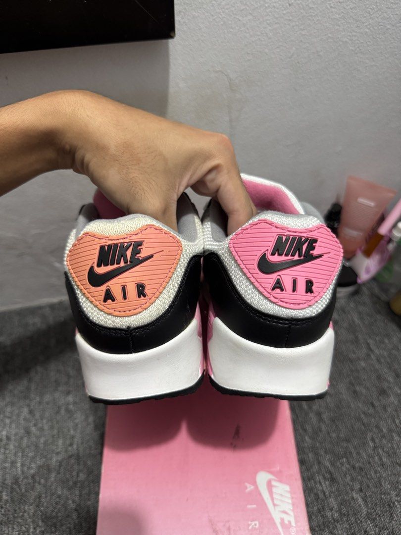 Nike Air Max 90 Pink Grey White Sneakers (Category: Sneakers) located in Mabalacat. Submitted by _allinmarket (Listing ID 1465909093, Image 2). Description: Nike Air Max 90 sneakers in a grey, white, pink 100% percent authentic Good condition With box! Issue: left pair has a part of discoloration .