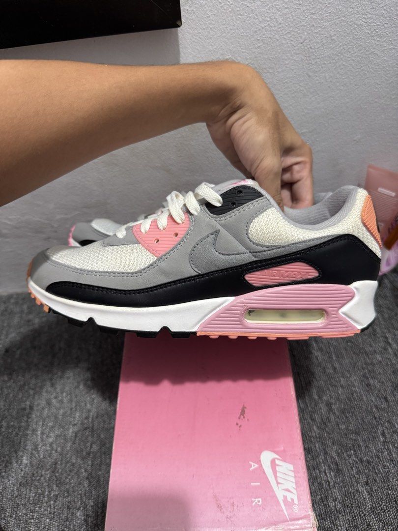 Nike Air Max 90 Pink Grey White Sneakers (Category: Sneakers) located in Mabalacat. Submitted by _allinmarket (Listing ID 1465909093, Image 3). Description: Nike Air Max 90 sneakers in a grey, white, pink 100% percent authentic Good condition With box! Issue: left pair has a part of discoloration .