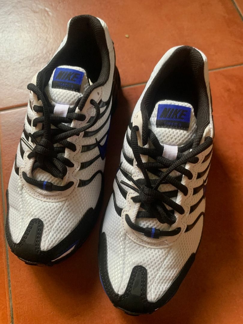 Nike Air Max Torch 4 White Blue Black (Category: Sneakers) located in Quezon City. Submitted by armicg (Listing ID 1465772921, Image 1). Description: - Authentic Nike Air Max Torch 4 sneakers - Colorway: White mesh upper with black overlays and royal blue swoosh details - Design: Classic lace-up front with black laces and blue tongue patch accents - Cushioning: Visible Air Max unit in the heel for maximum comfort - Versatile: Perfect for daily ca