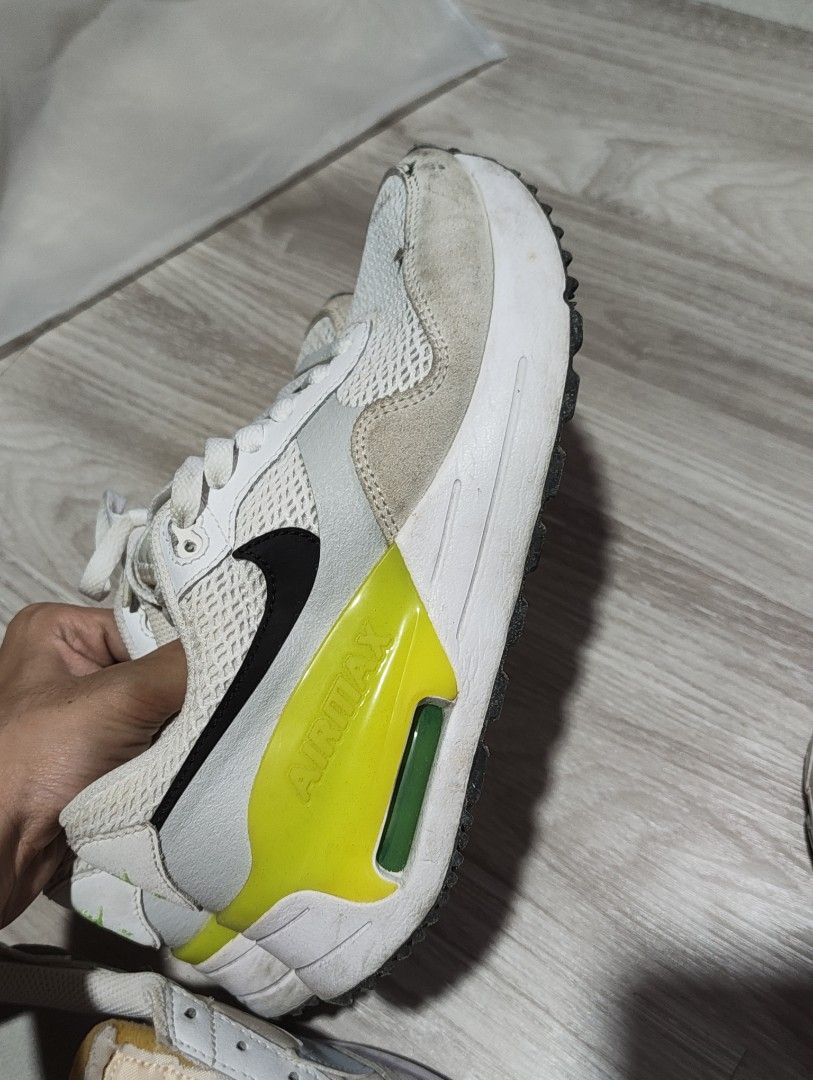 Nike Air Max White (Category: Sneakers) located in Malabon City. Submitted by mikeshisho (Listing ID 1465823710, Image 1). Description: - Brand: Nike Air Max - Colorway: White, Black, and Neon Yellow Volt - Size: Women's size 6.5 - Material: Mesh and suede upper panels - Cushioning: Classic visible Air Max heel unit - Condition/Inclusions: Comes with original shoebox - Style: Great everyday kicks with a bold pop of color.