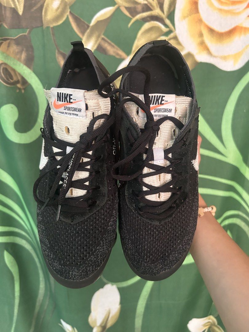 Nike Air Vapormax Off-White Black (Category: Sneakers) located in Malaybalay. Submitted by thrifturessential (Listing ID 1465779550, Image 2). Description: - Brand: Nike x Off-White - Model: Air VaporMax - Colorway: Black with oversized white swoosh - Details: Signature text graphics, exposed foam tongue with orange tag - Sole: Full-length black Air unit - Style: Classic deconstructed look - Condition: [Insert Condition] - Meetups and shipping av