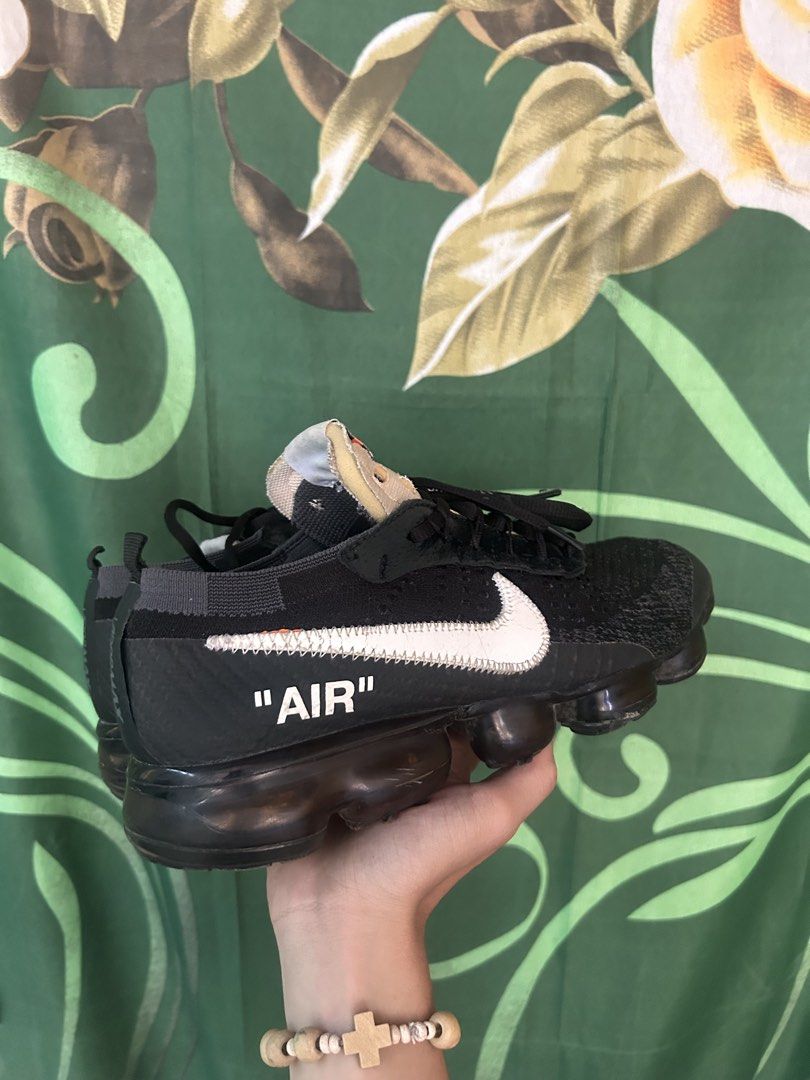 Nike Air Vapormax Off-White Black (Category: Sneakers) located in Malaybalay. Submitted by thrifturessential (Listing ID 1465779550, Image 3). Description: - Brand: Nike x Off-White - Model: Air VaporMax - Colorway: Black with oversized white swoosh - Details: Signature text graphics, exposed foam tongue with orange tag - Sole: Full-length black Air unit - Style: Classic deconstructed look - Condition: [Insert Condition] - Meetups and shipping av