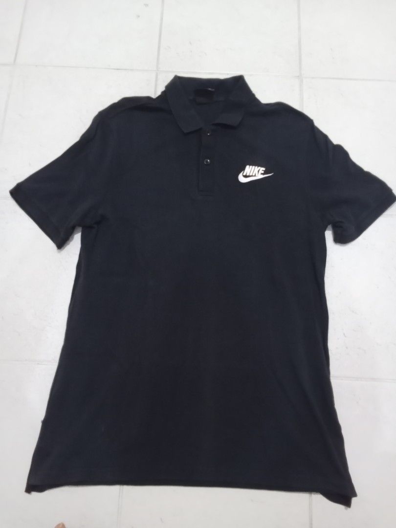 Nike Black Polo Shirt Size L (Category: Tshirts & Polo Shirts ) located in Manila. Submitted by kitkathrift (Listing ID 1465870163, Image 1). Description: - Brand: Nike - Style: Classic polo shirt - Color: Solid black with crisp white embroidered logo - Size: Large - Details: Standard collar with 2 buttons, short sleeves, lightweight material - Condition: Great for casual wear or sports.